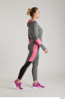  Mia Brown  1 dressed grey hoodie grey leggings pink sneakers side view sports walking whole body 0005.jpg